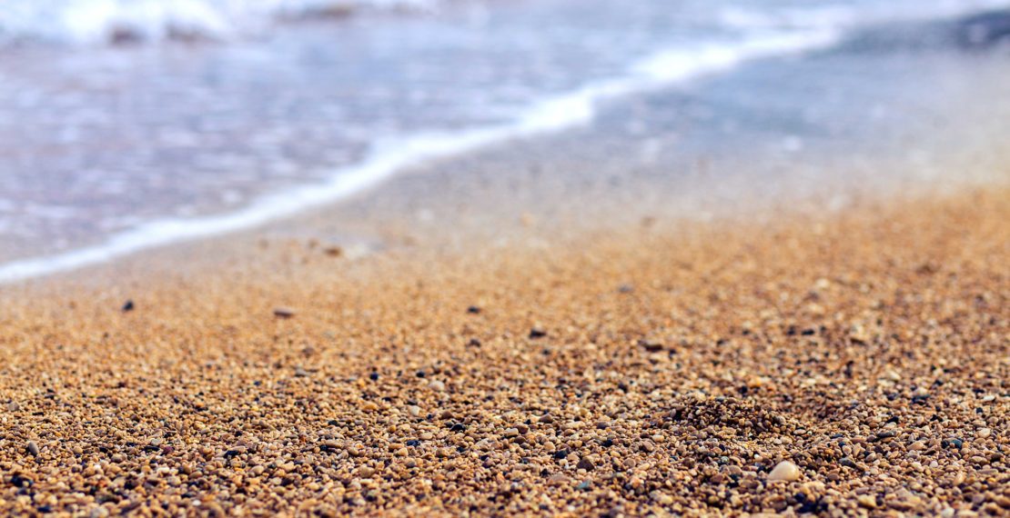 Sand and waves on the beach