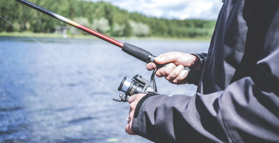 Man holding a fishing rod